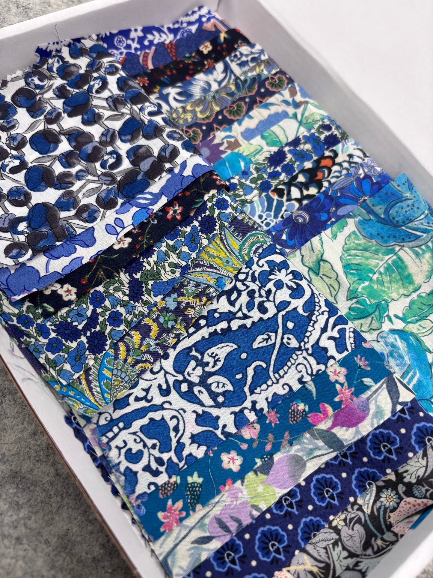 Liberty Tana Lawn colour-themed scrap boxes with hexie templates and backing fabric